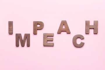 Word IMPEACH on color background