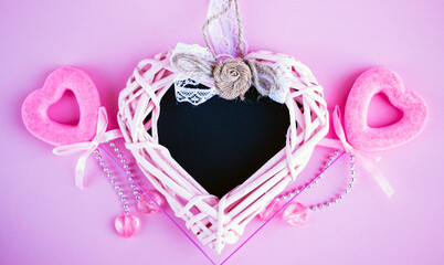 chalk board in shape of  heart for copying space or writing congratulation text, with various red and pink accessories in  shape of  heart, for  postcard or congratulations on Valentines Day