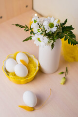 Congratulatory easter background. Easter eggs and flowers. Background with copy space. Selective focus.