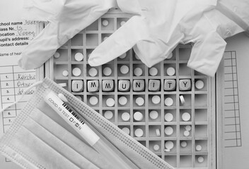 Word IMMUNITY composed of wooden dices. Flat lay