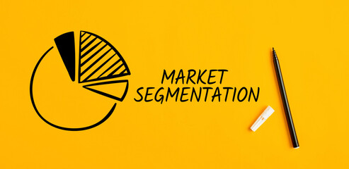 The word market segmentation with a hand drawn pie chart sketch on yellow background. Business...