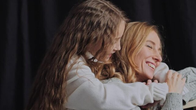 Happy mom and daughter fooling around. Happy Family concept in 4K slow motion