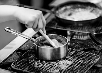 Chef cooking in a kitchen, chef at work, Black and White.