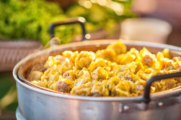Street food booth selling Chinese specialty Steamed Dumplings in Beijing