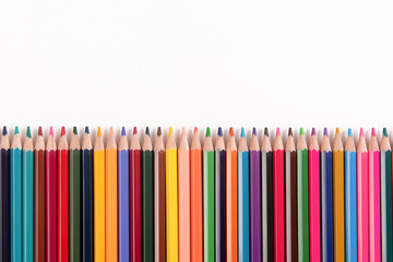Color pencils array isolated on white background