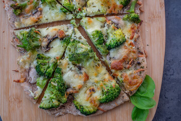 healthy green whole grain pizza with vegetables