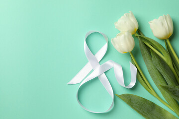 Eight made of ribbon and tulips on mint background