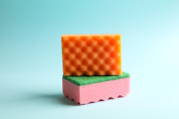 Color sponges for cleaning on blue background