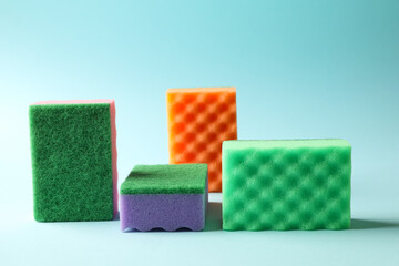 Color sponges for cleaning on blue background