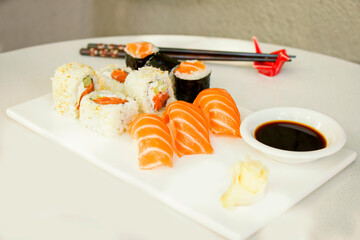 California sushi rolls set on the stone plate, sushi in restaurant, Wasabi and soy sauce