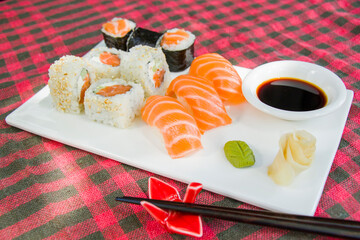 California sushi rolls set on the stone plate, sushi in restaurant, Wasabi and soy sauce