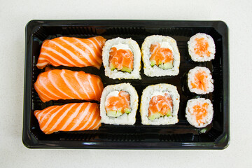 California sushi rolls set on the stone plate, sushi delivery set