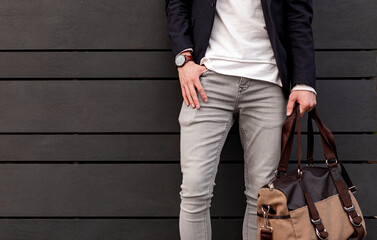 Stylish man with bag and wristwatch