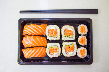California sushi rolls set on the stone plate, sushi delivery set