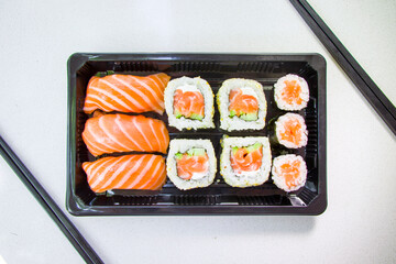 California sushi rolls set on the stone plate, sushi delivery set