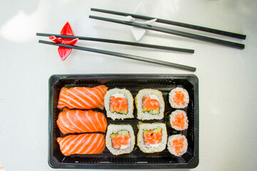 California sushi rolls set on the stone plate, sushi delivery set