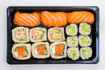 California sushi rolls set on the stone plate, sushi delivery set