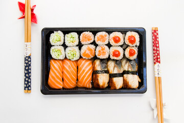 California an eel fish sushi rolls set on the stone plate, sushi delivery set