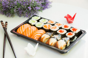California an eel fish sushi rolls set on the stone plate, sushi delivery set