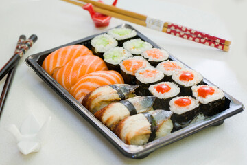 California an eel fish sushi rolls set on the stone plate, sushi delivery set