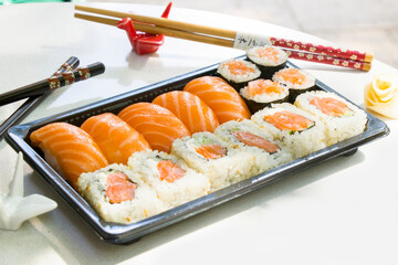 California sushi rolls set on the stone plate, sushi delivery set
