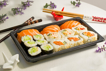 California sushi rolls set on the stone plate, sushi delivery set