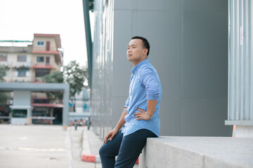 Portrait of Thai Gay men posing casual with happy outdoor.