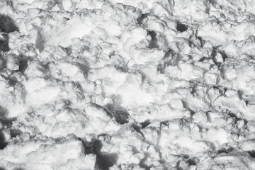 Texture of treaded snow. Black and white.