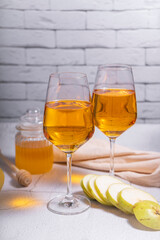 amber or orange wine made from white grapes. in a tall wine glass. Georgian national wine according to old technology