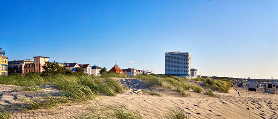 Panorama from the Hotel Neptun and the city of Warnemünde behind the dunes on the Baltic Sea beach.
