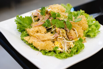 stir fried fish maw on white plate