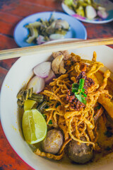 Khao soi - Traditional Thai Food, Thai curry with  A noodle dish in a yellow curry with chicken. 
Khao soy a famous northern Thai food