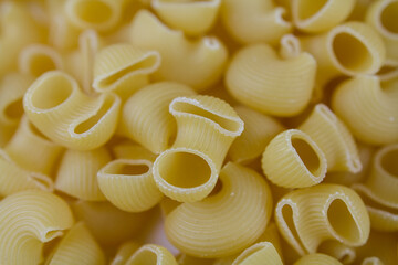 Italian pasta made from flour sprinkled on the table in large quantities