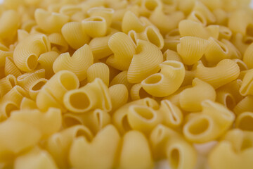 Italian pasta made from flour sprinkled on the table in large quantities