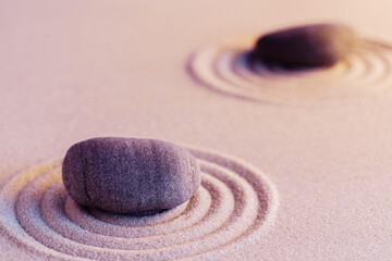 Fototapeta na wymiar Zen garden stones on sand with ornament