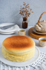 selective focus of cheesecake in a white plate on the table