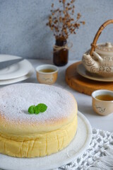 selective focus of cheesecake in a white plate on the table