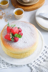 selective focus of cheesecake in a white plate on the table
