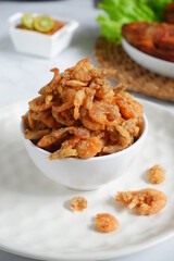 selective focus of fried crispy shrimp in a white bowl