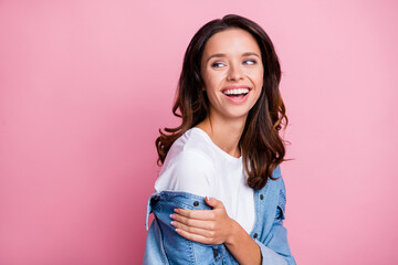 Profile side photo of attractive young woman look stand copyspace happy smile isolated on pastel pink color background