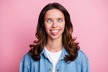 Fototapeta premium Photo of fooling cheerful cute young woman stick out tongue grimace isolated on pastel pink color background