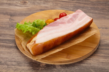 Smoked pork breast with salad leaves