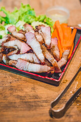 Grill pork neck  and spicy sauce on wooden