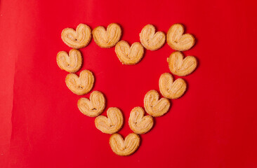 heart made of cookies on a red background