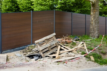 Illegal dumped debris in the front of the residential area