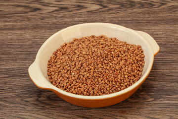 Raw buсkwheat cereal in the bowl
