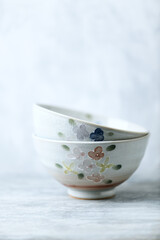 Traditional ceramic bowls on bright background