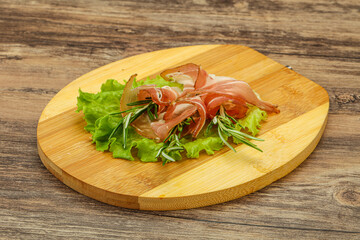 Sliced pork Jamon with rosemary