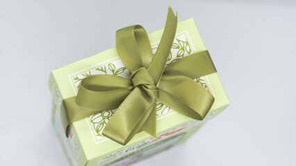 Green gift box with green bow for a fun holiday or birthday party