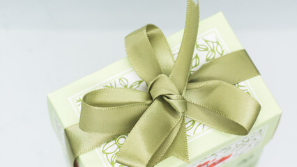 Green gift box with green bow for a fun holiday or birthday party